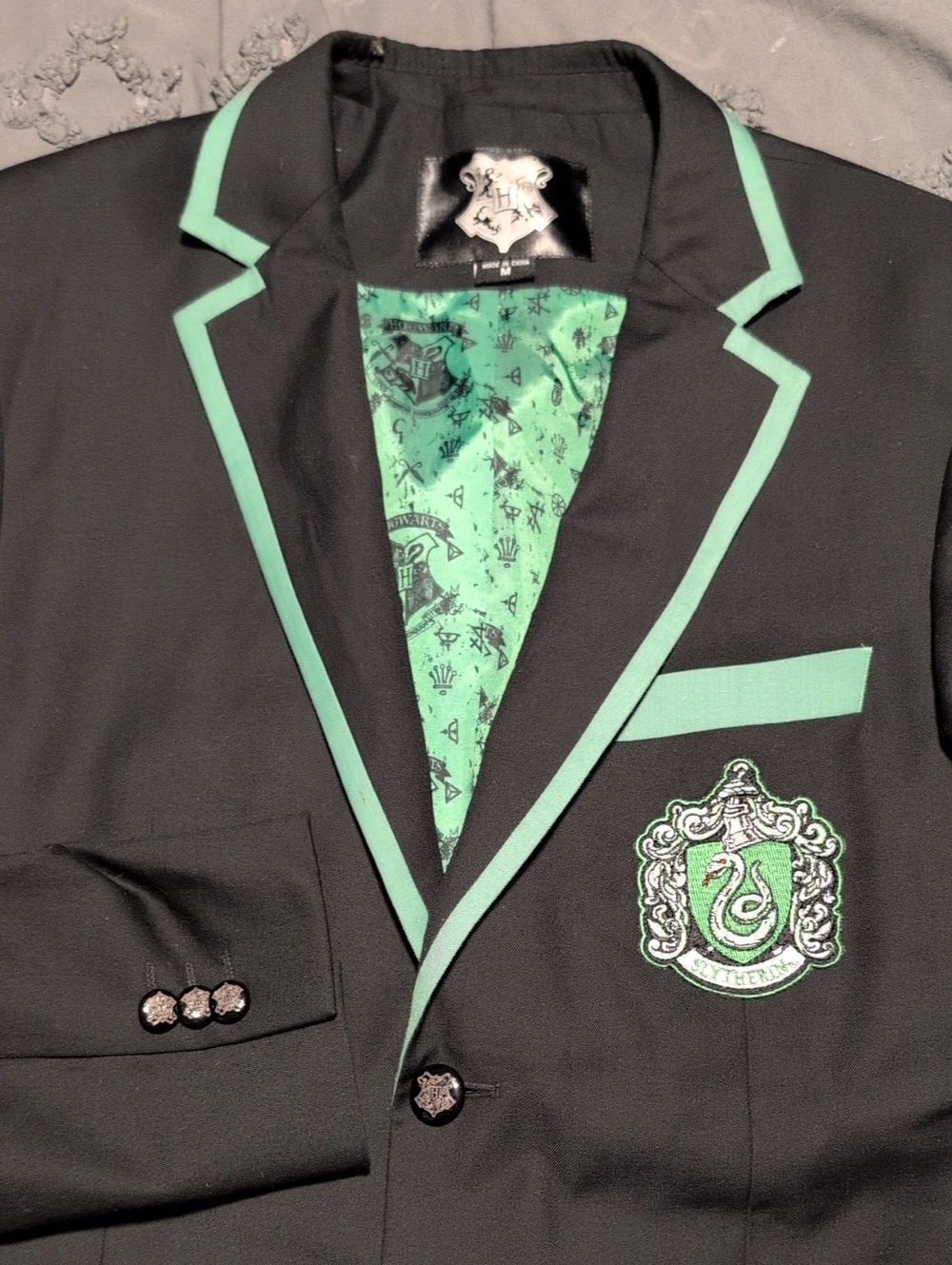 Black Blazer with Green Trim and Crest Patch